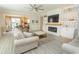 Comfortable living room with fireplace and neutral furnishings offers an inviting space to relax at 5059 Sundrop Ln., Little River, SC 29566