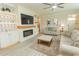 Inviting living room with modern fireplace, built-in shelving, and stylish decor for relaxation at 5059 Sundrop Ln., Little River, SC 29566
