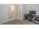 Office space boasts natural light and access to a mudroom through glass french doors at 5059 Sundrop Ln., Little River, SC 29566