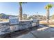 Outdoor kitchen with built-in grills and stone countertops, perfect for entertaining guests at 5059 Sundrop Ln., Little River, SC 29566