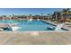 Inviting swimming pool with in-pool lounge chairs, surrounded by palm trees and community amenities at 5059 Sundrop Ln., Little River, SC 29566