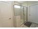 Modern glass enclosed shower with white tile surround, including marble accents and a window at 5059 Sundrop Ln., Little River, SC 29566