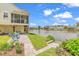 Charming backyard features a waterfront view, patio, and lush landscaping, perfect for outdoor relaxation at 521 Bay Drive Ext., Garden City Beach, SC 29576