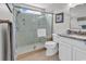 Bathroom highlighting a spacious glass shower, a modern toilet, and a vanity with granite countertops at 521 Bay Drive Ext., Garden City Beach, SC 29576