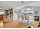 Inviting dining area adjacent to the kitchen with natural light and stunning views of the waterfront at 521 Bay Drive Ext., Garden City Beach, SC 29576