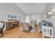 Cozy living room with hardwood floors, comfortable seating, a ceiling fan and a television at 521 Bay Drive Ext., Garden City Beach, SC 29576