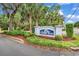 Welcoming Salters Cove sign surrounded by lush greenery creates a pleasant first impression at 521 Bay Drive Ext., Garden City Beach, SC 29576