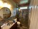 Upgraded bathroom with granite counter, copper sink, and glass shower with decorative tile at 5718 Herring Gull Circle, North Myrtle Beach, SC 29582