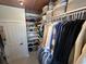 Walk-in closet with wooden floors, custom shelving, and organized storage at 5718 Herring Gull Circle, North Myrtle Beach, SC 29582