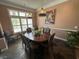 Cozy dining room with large windows, natural light, and stylish decor at 5718 Herring Gull Circle, North Myrtle Beach, SC 29582