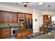 Elegant kitchen with dark cabinets, granite countertops, and modern appliances at 5718 Herring Gull Circle, North Myrtle Beach, SC 29582