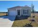 Charming single-story home with a one-car garage and well-maintained lawn on a sunny day at 576 Strawberry Field Way, Galivants Ferry, SC 29544