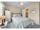Comfortable bedroom featuring a bed and view into the bathroom at 613 S 2Nd Ave. # 21D, North Myrtle Beach, SC 29582