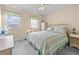 Cozy bedroom with bright windows, ceiling fan, and colorful bedding at 613 S 2Nd Ave. # 21D, North Myrtle Beach, SC 29582