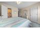 A bright, quaint bedroom with a doorway to the ensuite bathroom at 613 S 2Nd Ave. # 21D, North Myrtle Beach, SC 29582