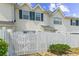 Rear exterior showing a white fence for privacy with green shrubs at 613 S 2Nd Ave. # 21D, North Myrtle Beach, SC 29582