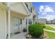 Charming two-story home with covered front entrance and lush landscaping at 613 S 2Nd Ave. # 21D, North Myrtle Beach, SC 29582