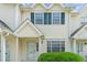 Charming townhome featuring teal shutters, neutral siding, and well-maintained landscaping at 613 S 2Nd Ave. # 21D, North Myrtle Beach, SC 29582