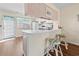 Kitchen with an extended counter and barstool seating overlooking the sink and microwave at 613 S 2Nd Ave. # 21D, North Myrtle Beach, SC 29582