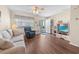 Comfortable living room with wood floors, a ceiling fan, and access to an outside patio at 613 S 2Nd Ave. # 21D, North Myrtle Beach, SC 29582