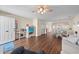 Open-concept living space features wood floors, neutral tones, and natural light at 613 S 2Nd Ave. # 21D, North Myrtle Beach, SC 29582