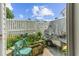 Patio view with white picket fence, green foliage, and trailer at 613 S 2Nd Ave. # 21D, North Myrtle Beach, SC 29582