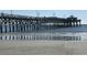 View of the pier at Myrtle Beach reflecting off of the wet sand below at 613 S 2Nd Ave. # 21D, North Myrtle Beach, SC 29582