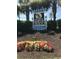 Sign at North Myrtle Beach features vibrant flower beds and palm tree surroundings at 613 S 2Nd Ave. # 21D, North Myrtle Beach, SC 29582