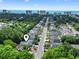 Aerial shot of residential street with mature trees, featuring ocean and city views at 618 5Th Ave. S, North Myrtle Beach, SC 29582