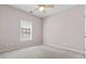Neutral bedroom featuring a ceiling fan, window with blinds, and plush carpet at 618 5Th Ave. S, North Myrtle Beach, SC 29582