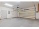 Spacious two-car garage with a roll up door and ample room for parking and storage at 618 5Th Ave. S, North Myrtle Beach, SC 29582