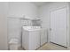 Practical laundry room with a washer, dryer, shelving and easy access to the outside at 618 5Th Ave. S, North Myrtle Beach, SC 29582