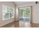 Living room with sliding doors to patio, large window and wood-style floors at 618 5Th Ave. S, North Myrtle Beach, SC 29582