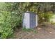 A storage shed surrounded by trees and lush foliage at 618 5Th Ave. S, North Myrtle Beach, SC 29582