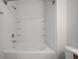 Clean bathroom with shower featuring tiled walls, built-in shelves, and modern fixtures at 6253 Catalina Dr. # 1523, North Myrtle Beach, SC 29582
