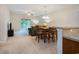 Dining room with wooden table, chairs and next to the living room and kitchen at 6253 Catalina Dr. # 1523, North Myrtle Beach, SC 29582