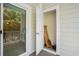 Covered porch and door to a storage closet, accessible from the outside, with a sliding glass door to the interior at 6253 Catalina Dr. # 1523, North Myrtle Beach, SC 29582