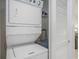 Closet containing stacked washer and dryer with water heater, located near the living area at 6253 Catalina Dr. # 1523, North Myrtle Beach, SC 29582
