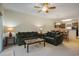 Living room with plush couches, ceiling fan, lamps, and dining table in an open concept at 6253 Catalina Dr. # 1523, North Myrtle Beach, SC 29582