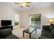 Living room with sofas, television and slider doors leading to balcony at 6253 Catalina Dr. # 1523, North Myrtle Beach, SC 29582