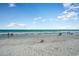 Expansive beach scene with serene ocean views and scattered beachgoers enjoying the day at 6813 Porcher Dr. # 1, Myrtle Beach, SC 29572