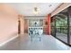 Bright dining room with sliding glass doors and a view to the balcony at 6813 Porcher Dr. # 1, Myrtle Beach, SC 29572