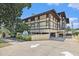Attractive condo building with unique architecture and professional landscaping during the daytime at 6813 Porcher Dr. # 1, Myrtle Beach, SC 29572