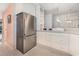 Well-lit kitchen with stainless steel refrigerator and plenty of counter space at 6813 Porcher Dr. # 1, Myrtle Beach, SC 29572