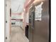 Galley kitchen with a stainless steel refrigerator and white appliances at 6813 Porcher Dr. # 1, Myrtle Beach, SC 29572