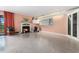 Bright and airy living room space with a fireplace and access to the balcony at 6813 Porcher Dr. # 1, Myrtle Beach, SC 29572
