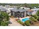 Aerial view of condominiums featuring a community pool, balcony views, and well-maintained landscaping at 6813 Porcher Dr. # 25, Myrtle Beach, SC 29572