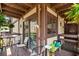 Balcony featuring a seating area with views of the building exterior and lush plants at 6813 Porcher Dr. # 25, Myrtle Beach, SC 29572
