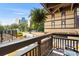 Apartment balcony overlooking lush greenery and a neighboring building on a sunny day at 6813 Porcher Dr. # 25, Myrtle Beach, SC 29572