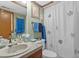 Clean bathroom featuring a vanity and shower with a decorative shower curtain at 6813 Porcher Dr. # 25, Myrtle Beach, SC 29572